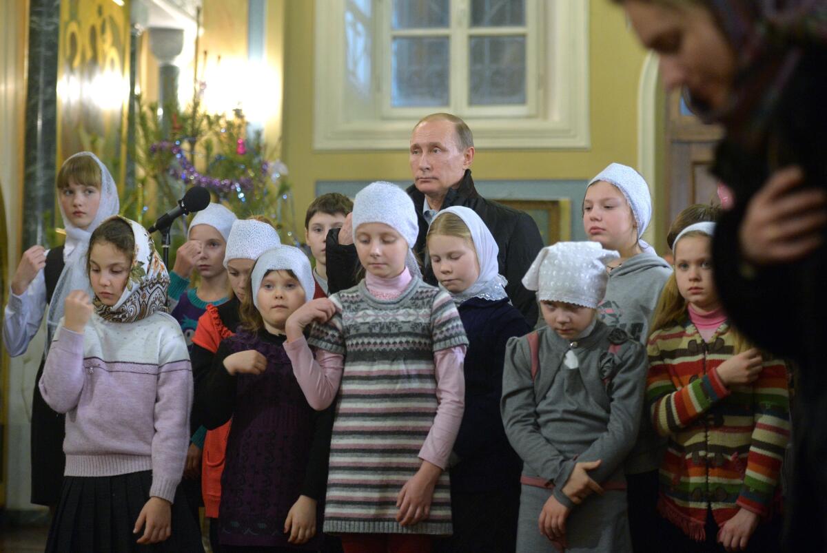 Russian President Vladimir Putin, shown at a Mass.