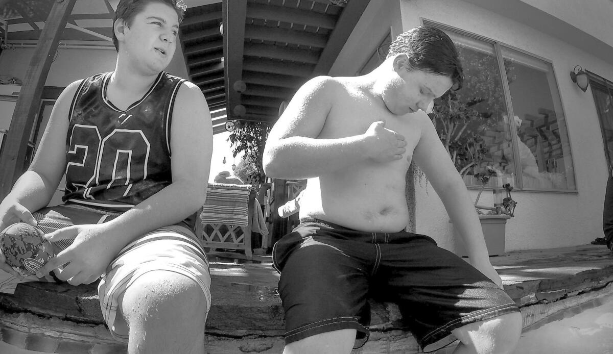 About six weeks after his double mastectomy, Sam Moehlig, 14, enjoys the freedom of taking off his shirt at a pool party at a friend's house in San Diego.