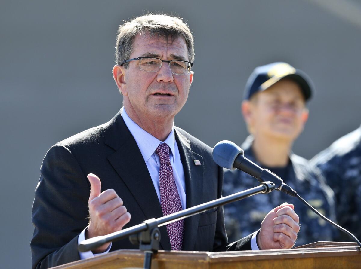 Secretary of Defense Ashton Carter answers questions while talking with Navy personnel during a visit to the San Diego Naval Base on Wednesday.