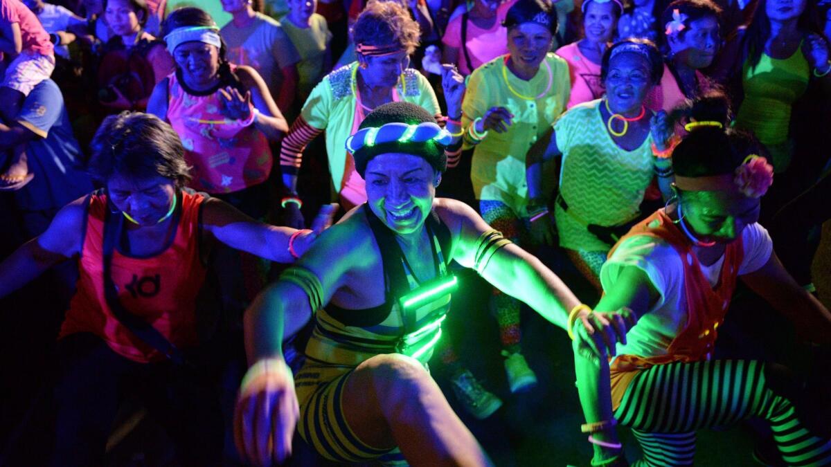 The Colombian dance-based exercise called Zumba has spread around the world, as shown in this Zumba class in Manila, Philippines.