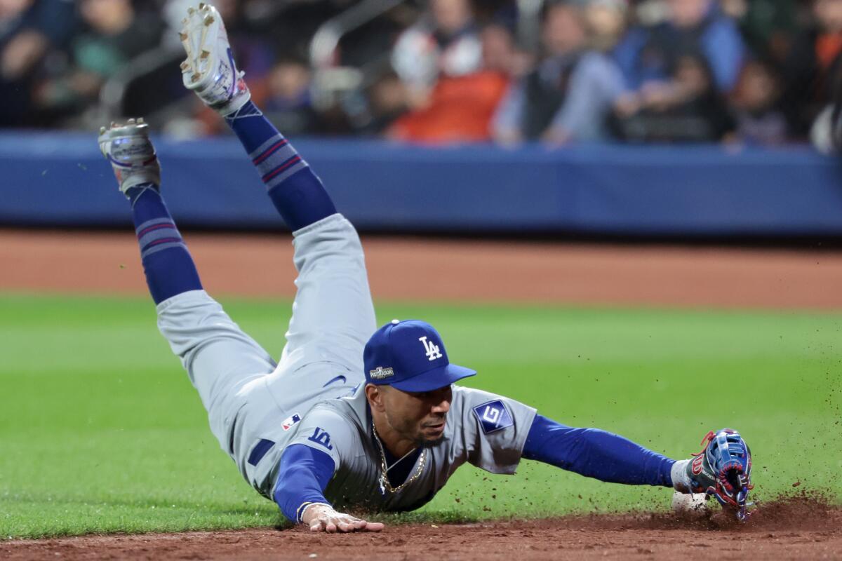 Dodgers right fielder Mookie Betts just misses out on making a diving catch.