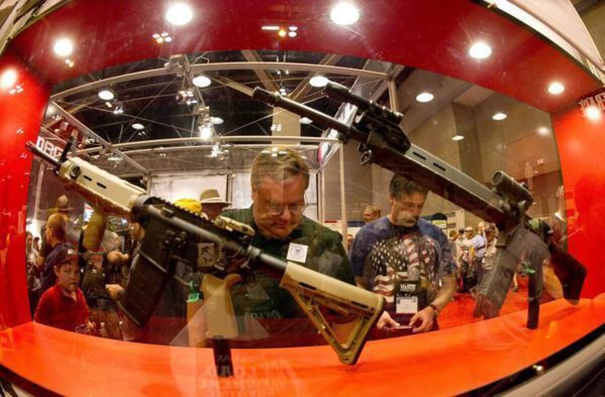 At the National Rifle Assn.'s annual meeting in April in St. Louis, plenty of firearms were on display. A poll finds that 92% of Americans want background checks for buyers at gun shows.