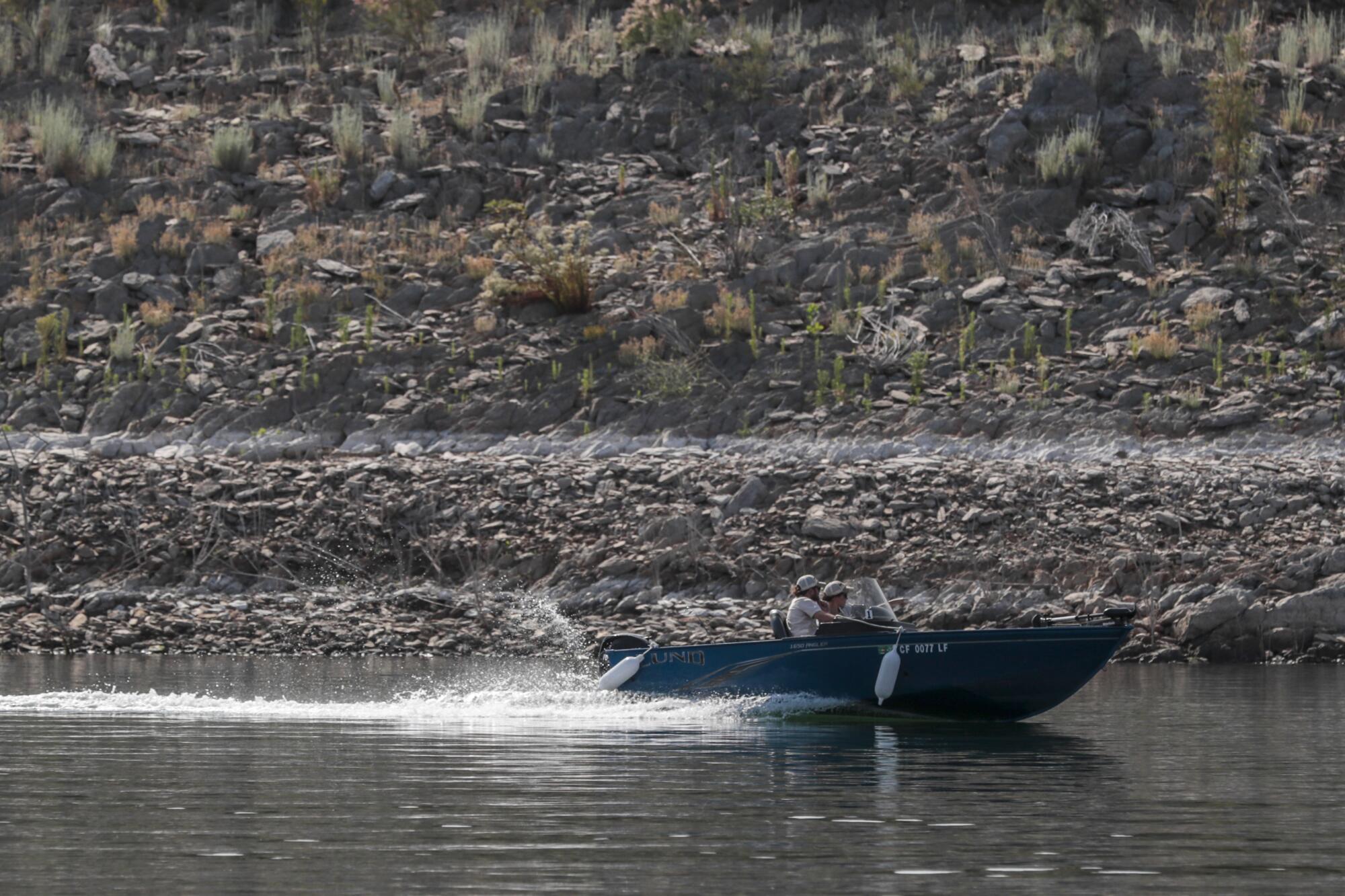 A moving boat on a lake.