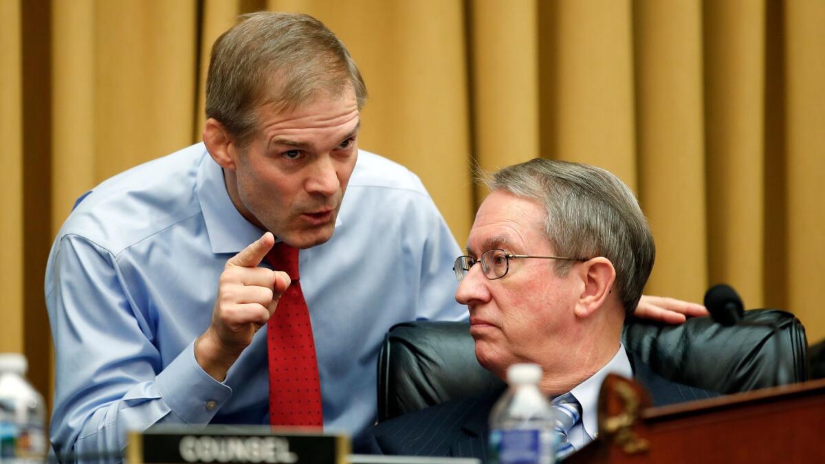 Rep. Jim Jordan (R-Ohio), left, talks with House Judiciary Committee Chairman Robert W. Goodlatte (R-Va.) during a recent hearing on Capitol Hill.