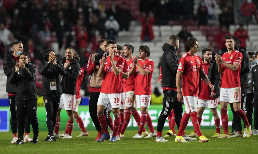 Benfica's players applaud at the end of the Champions League group E soccer match between Benfica and Dynamo Kyiv at the Luz stadium in Lisbon, Wednesday, Dec. 8, 2021. (AP Photo/Armando Franca)