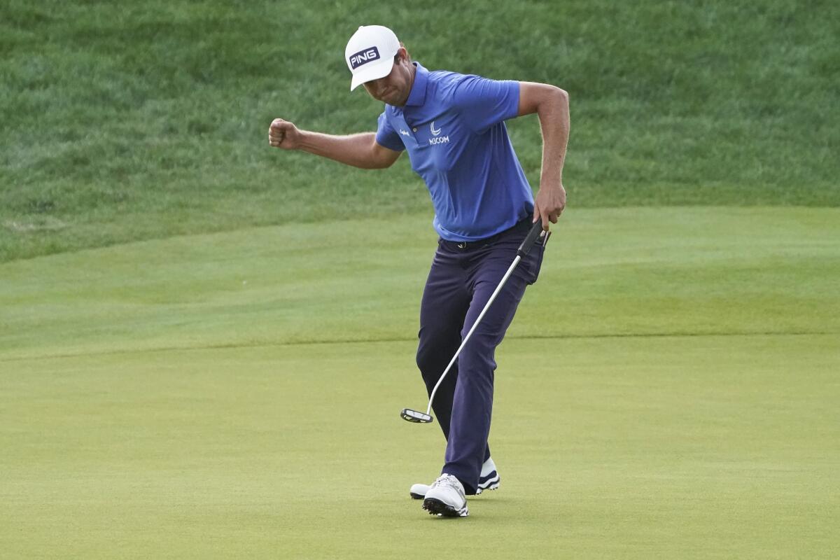 Harris English reacts after sinking a putt on the eighth playoff hole to win the Travelers Championship on Sunday.