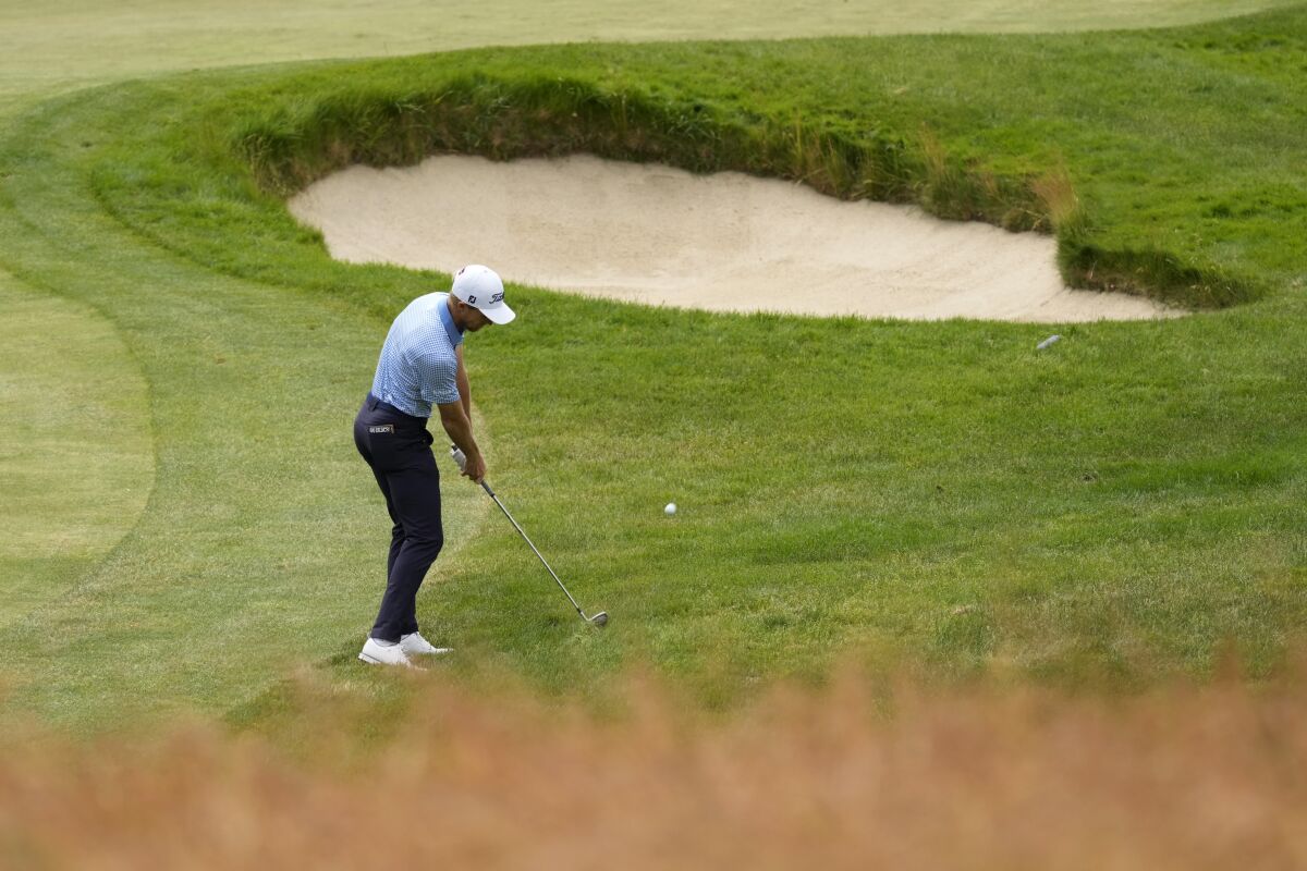 Will Zalatoris hits on the seventh hole during the third round of the U.S. Open golf tournament at The Country Club, Saturday, June 18, 2022, in Brookline, Mass. (AP Photo/Charlie Riedel)