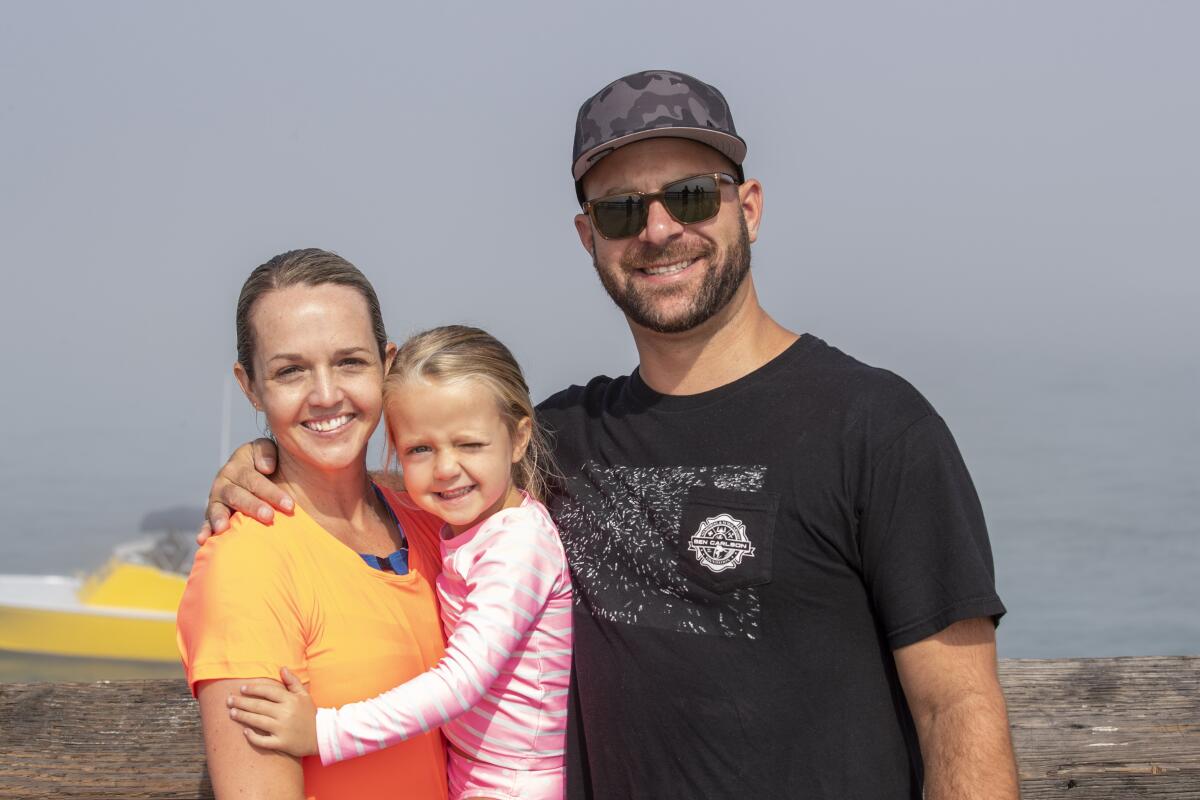 Shannon, Charlotte and James Papazis at the Newport Pier jump fundraising event