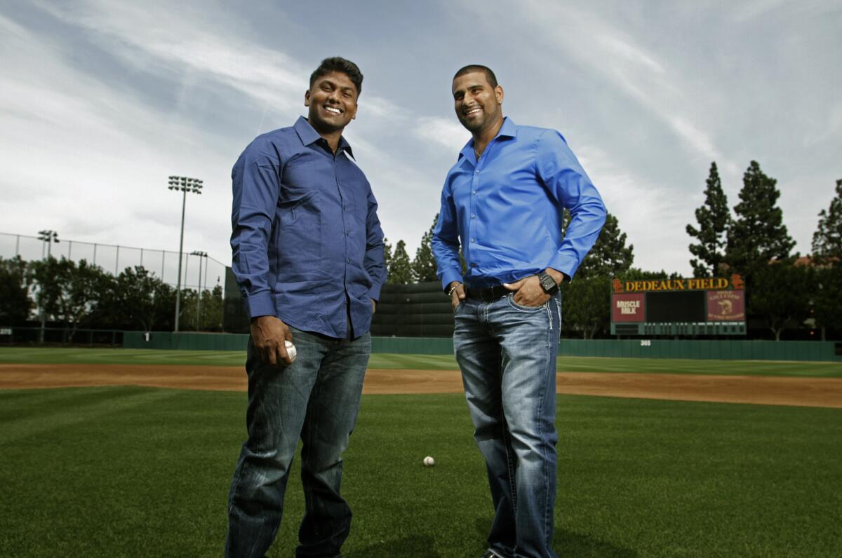 "Million Dollar Arm" is based on the improbable story of Dinesh Patel, left, and Rinku Singh.