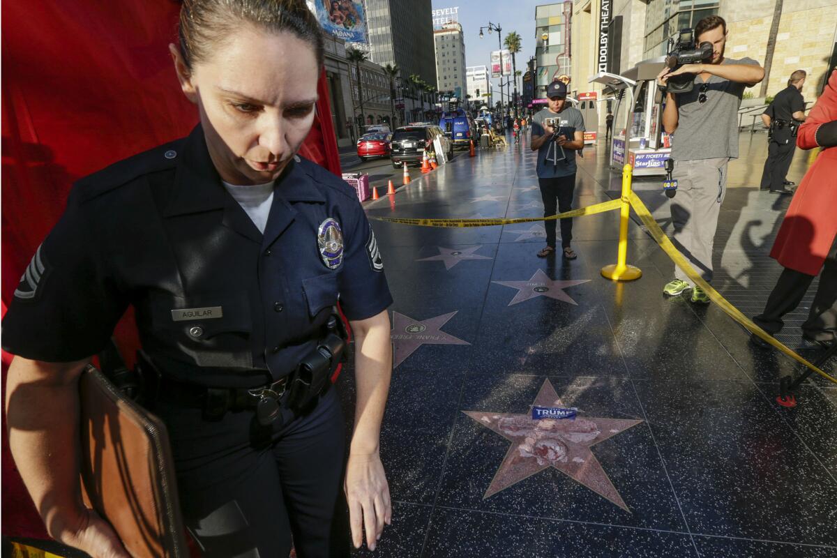 L.A. police Det. Meghan Aguilar can be seen near Donald Trump's vandalized star on the Hollywood Walk of Fame. The star, in the 6800 block of Hollywood Boulevard, was damaged sometime overnight, the Los Angeles Police Department reported.
