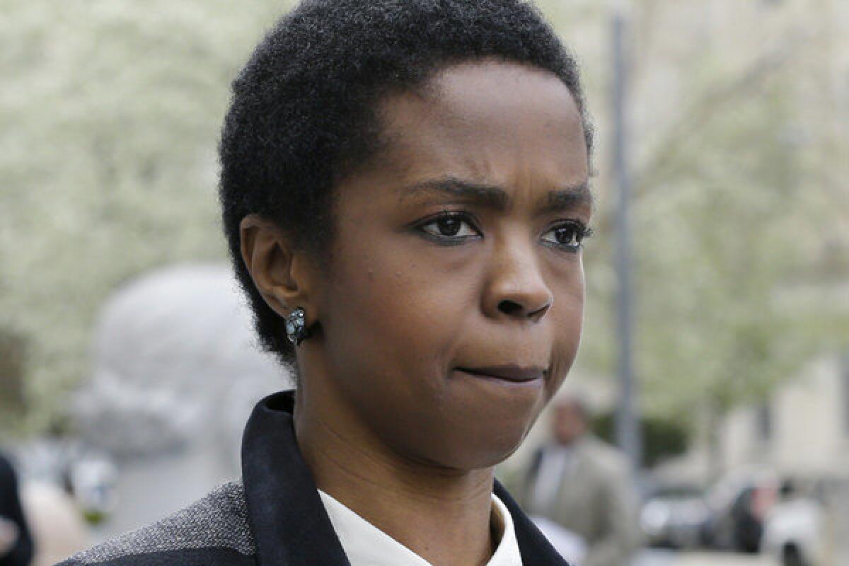 Singer Lauryn Hill walks from federal court in Newark, N.J., on Monday.