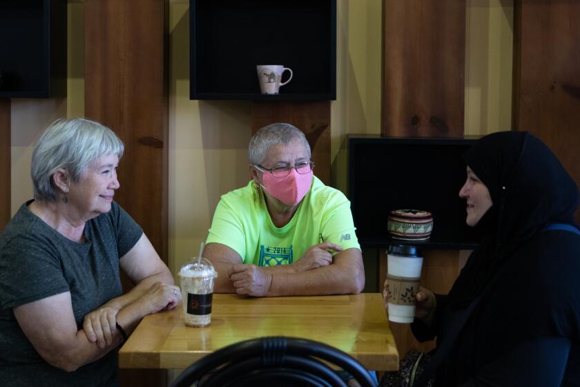 From left,  Beverly Babcock, Adela Majer, and Caitlin Al-Ansari meet for pasties and coffee at Qawah Housein Dearborn, Mich.