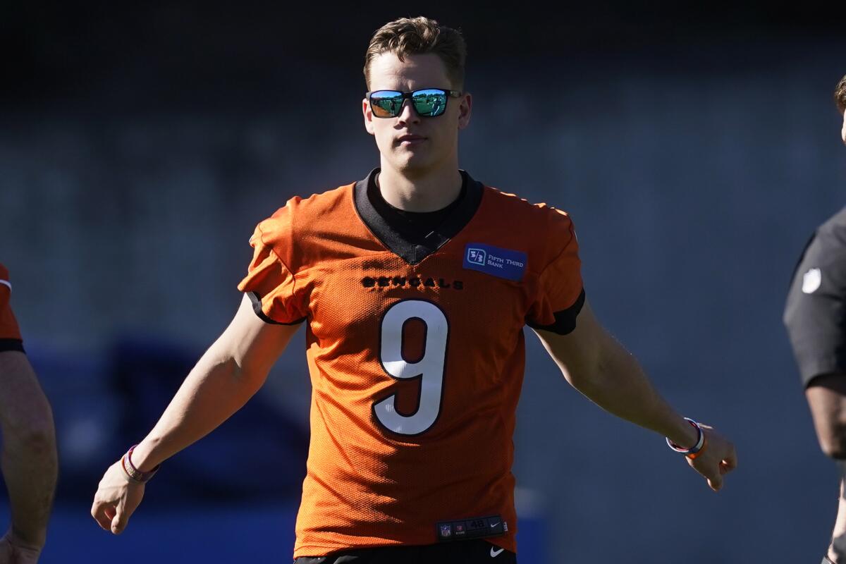 Cincinnati Bengals quarterback Joe Burrow stretches before a team practice session.