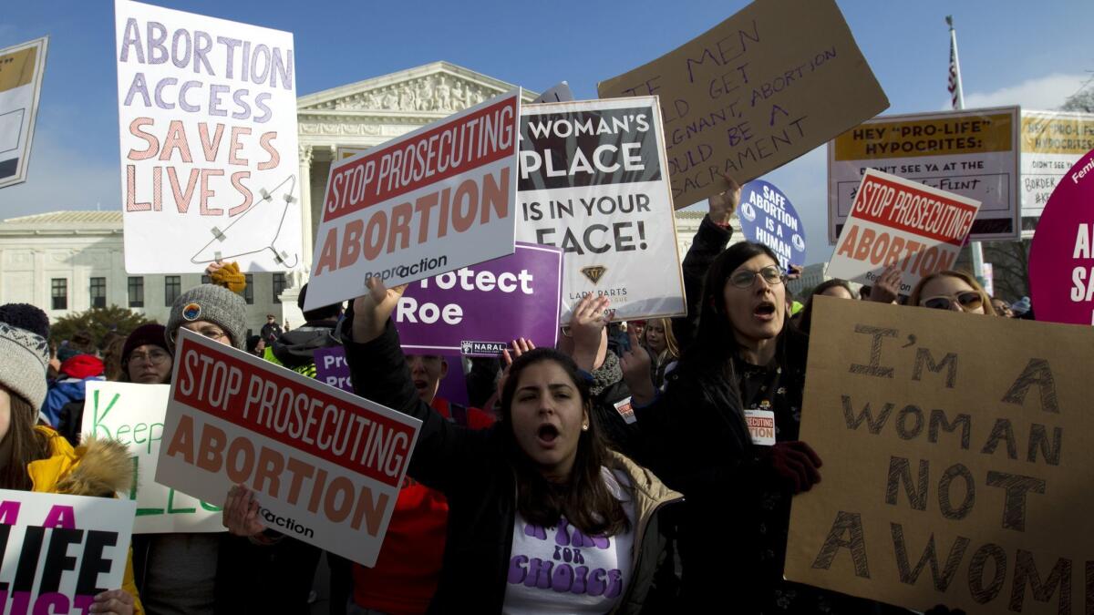 Abortion rights activists protest outside the U.S. Supreme Court during the March for Life in Washington in January.