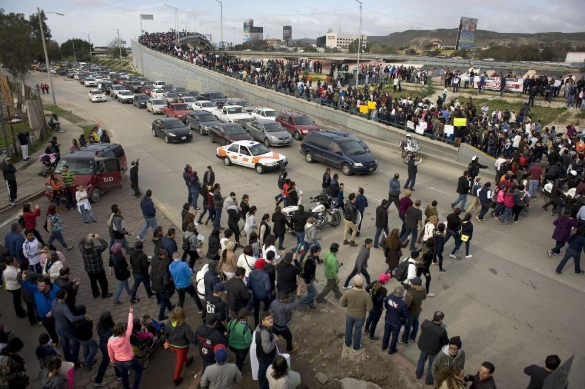 Thousands of people blocked traffic while protesting Mexico's recent gasoline price increases at Tijuana's El Chaparral port of entry Jan. 15.