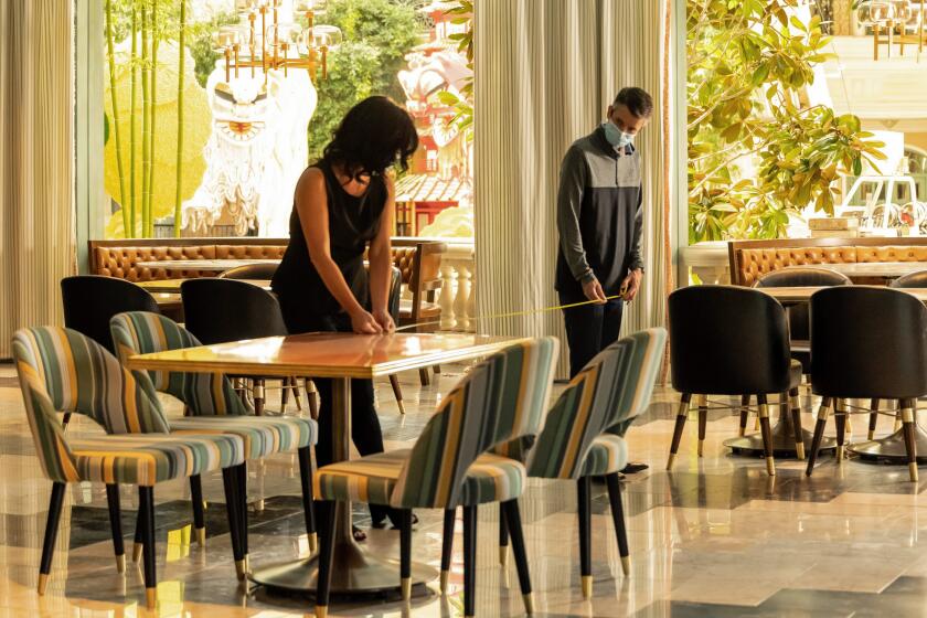 "Sadelle's:" Employees at Sadelle's restaurant at Bellagio strategize as to where to place tables to maintain social distancing. The resort is accepting reservations beginning June 1.