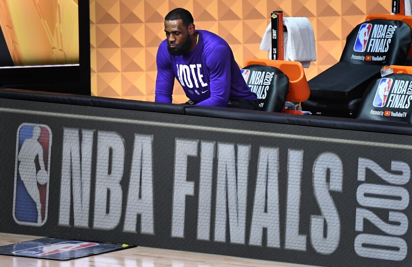 Lakers' LeBron James sits alone before Game 5 of the NBA Finals in Orlando.