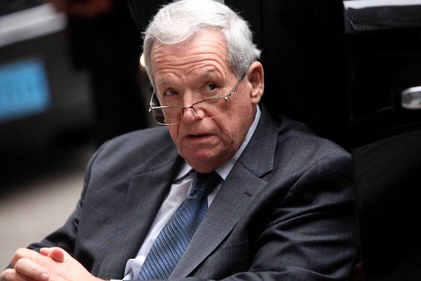 Former House Speaker Dennis Hastert leaves court in a wheelchair after his sentencing Wednesday.