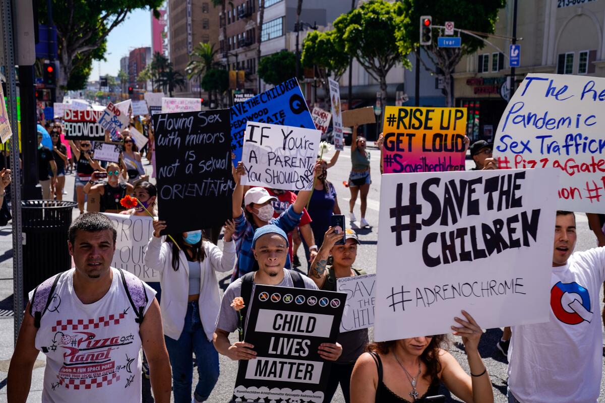  QAnon conspiracy theorists hold a rally in Hollywood on July 31.  