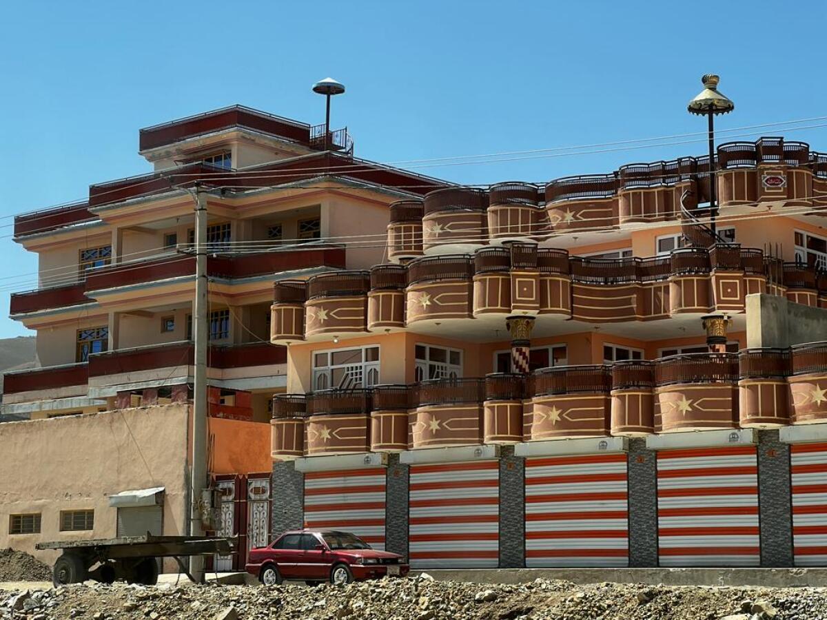 The facade of a multistory building features curved balconies.