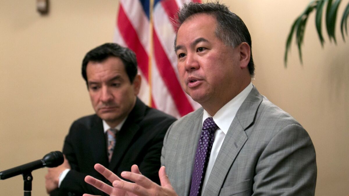 Assemblyman Phil Ting (D-San Francisco), right, has written a bill that would make some police body camera footage public.