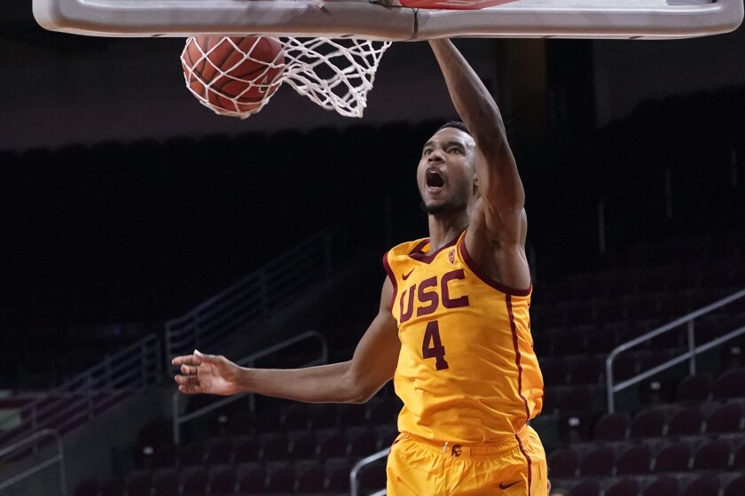 Southern California forward Evan Mobley (4) dunks against Washington during the second half of an NCAA college basketball game Thursday, Jan. 14, 2021, in Los Angeles. (AP Photo/Marcio Jose Sanchez)