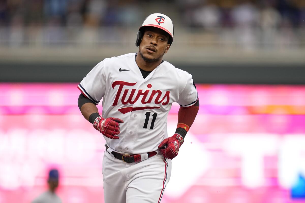 Minnesota Twins' Jorge Polanco (11) runs the bases after hitting a two-run home run against the Chicago Cubs during the fifth inning of a baseball game Saturday, May 13, 2023, in Minneapolis. (AP Photo/Abbie Parr)