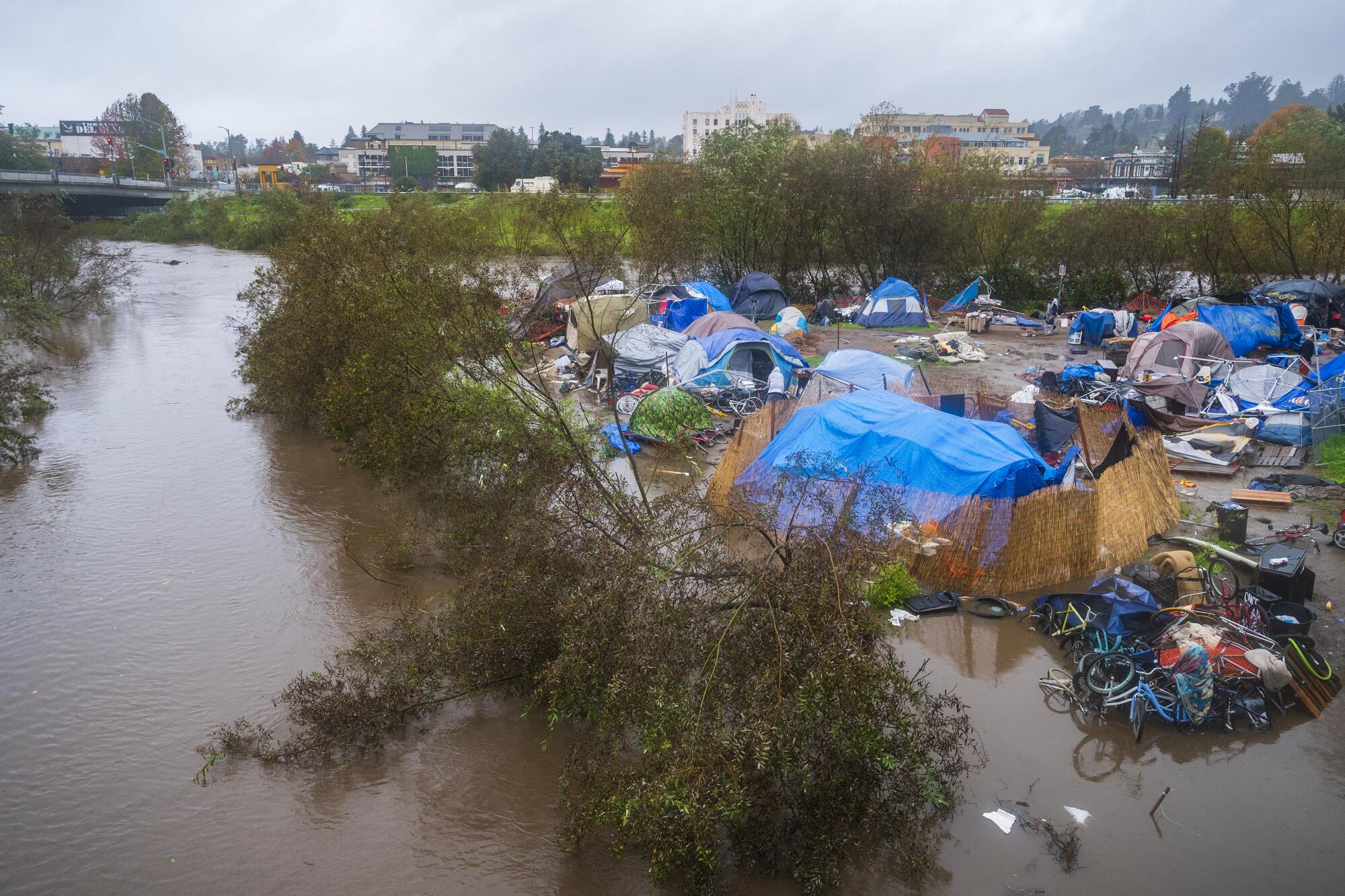 A flooded homeless encampment in Santa Cruz.
