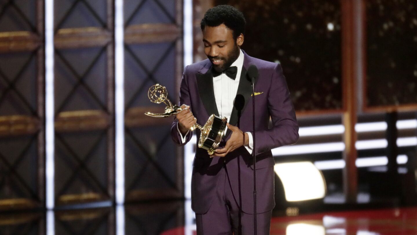 Donald Glover accepts the award for directing a comedy series for the "Atlanta" episode "B.A.N." at the 69th Emmy Awards.