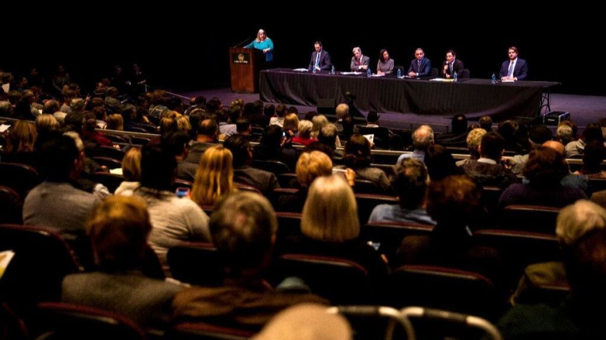 Congressional candidates Sam Jammal, Andy Thorburn, Mai-Khanh Tran, Gil Cisneros, Jay Chen and Phil Janowicz speak during a forum at Fullerton College on Jan. 10. The candidates are vying for the seat of outgoing U.S. Rep. Ed Royce (R-Fullerton).