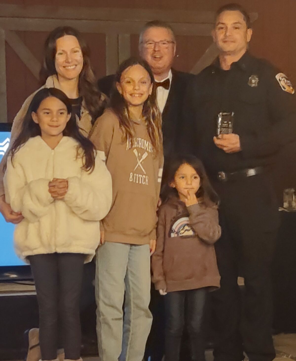 Firefighter of the Year William Grillo, right, with his wife, Vanessa, daughters Mila, Matea and Mari, and Paul Zawilenski.