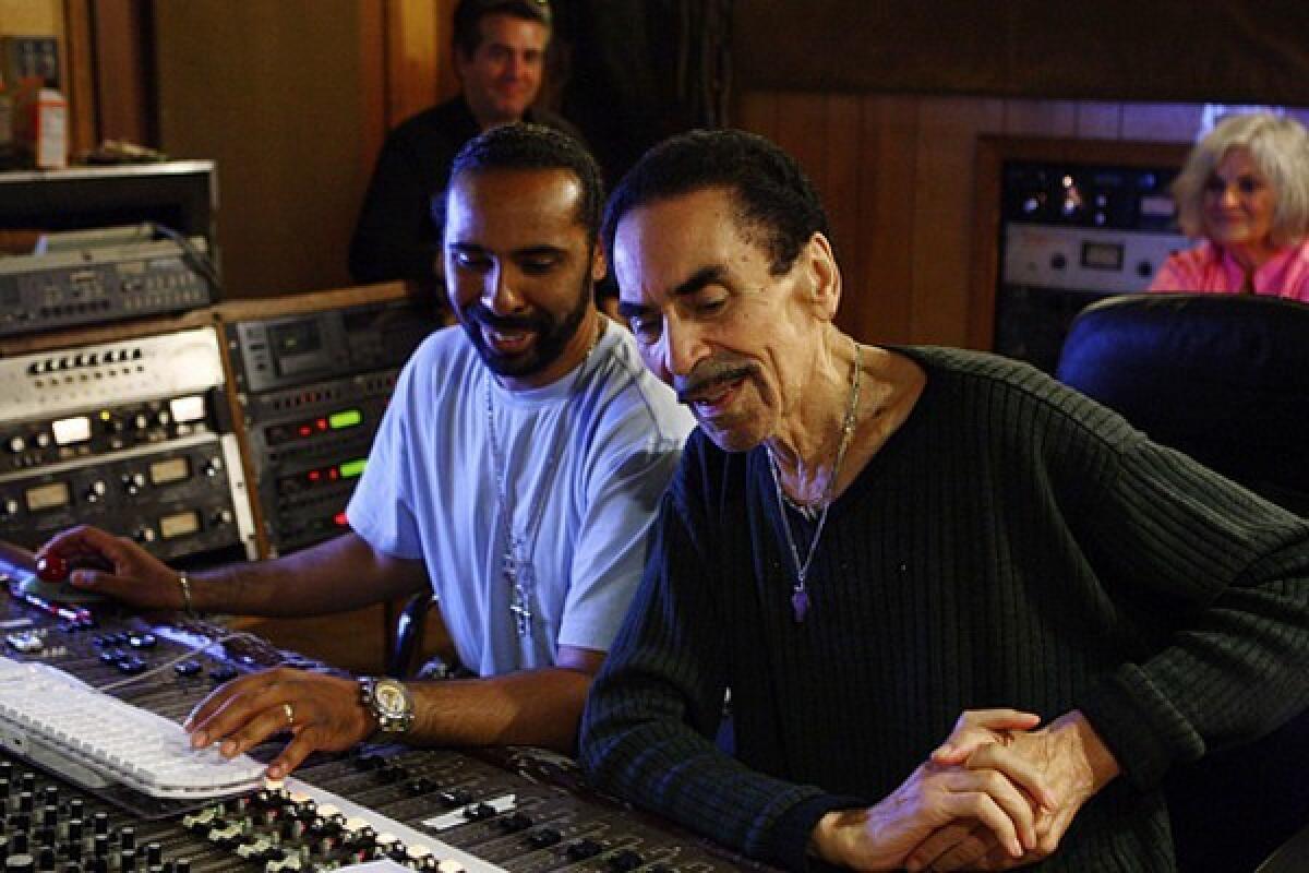 Willie Mitchell, right, works with his son Lawrence Mitchell at his Royal Studio in 2009. Trumpeter Mitchell had several hits in the '60s, including "Soul Serenade."