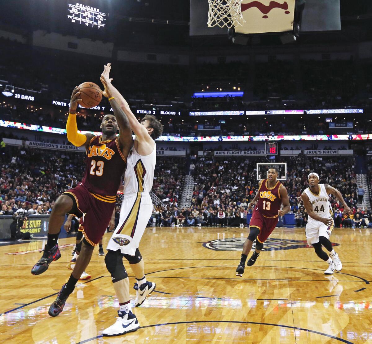 Cleveland Cavaliers forward LeBron James drives to the basket against New Orleans Pelicans center Omer Asik during the second half of a game on Dec. 4.