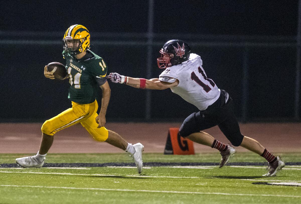 Edison's Parker Awad scrambles under pressure from Palos Verdes' Ryan Wilson during a nonleague game on Thursday.