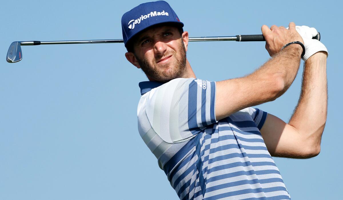 Dustin Johnson hits his tee shot on the third hole at Torrey Pines' South course during the first round of the Farmers Insurance Open on Thursday.