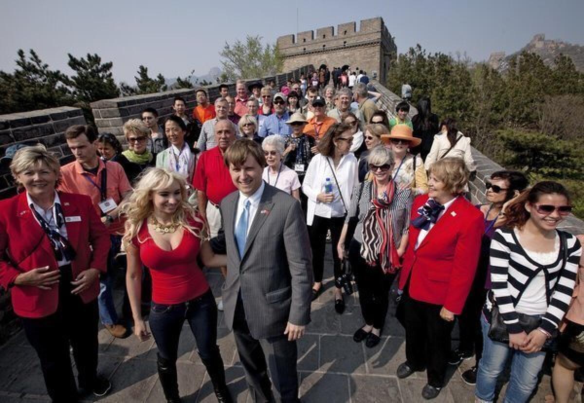 Christopher Cox, grandson of President Richard Nixon, center, with his wife Andrea Catsimatidis and the U.S. delegation tour the Great Wall of China at Badaling on Saturday.