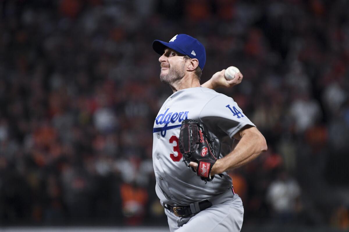 The Dodgers' Max Scherzer pitches in Game 5 of the National League Division Series at San Francisco on Oct. 14, 2021.