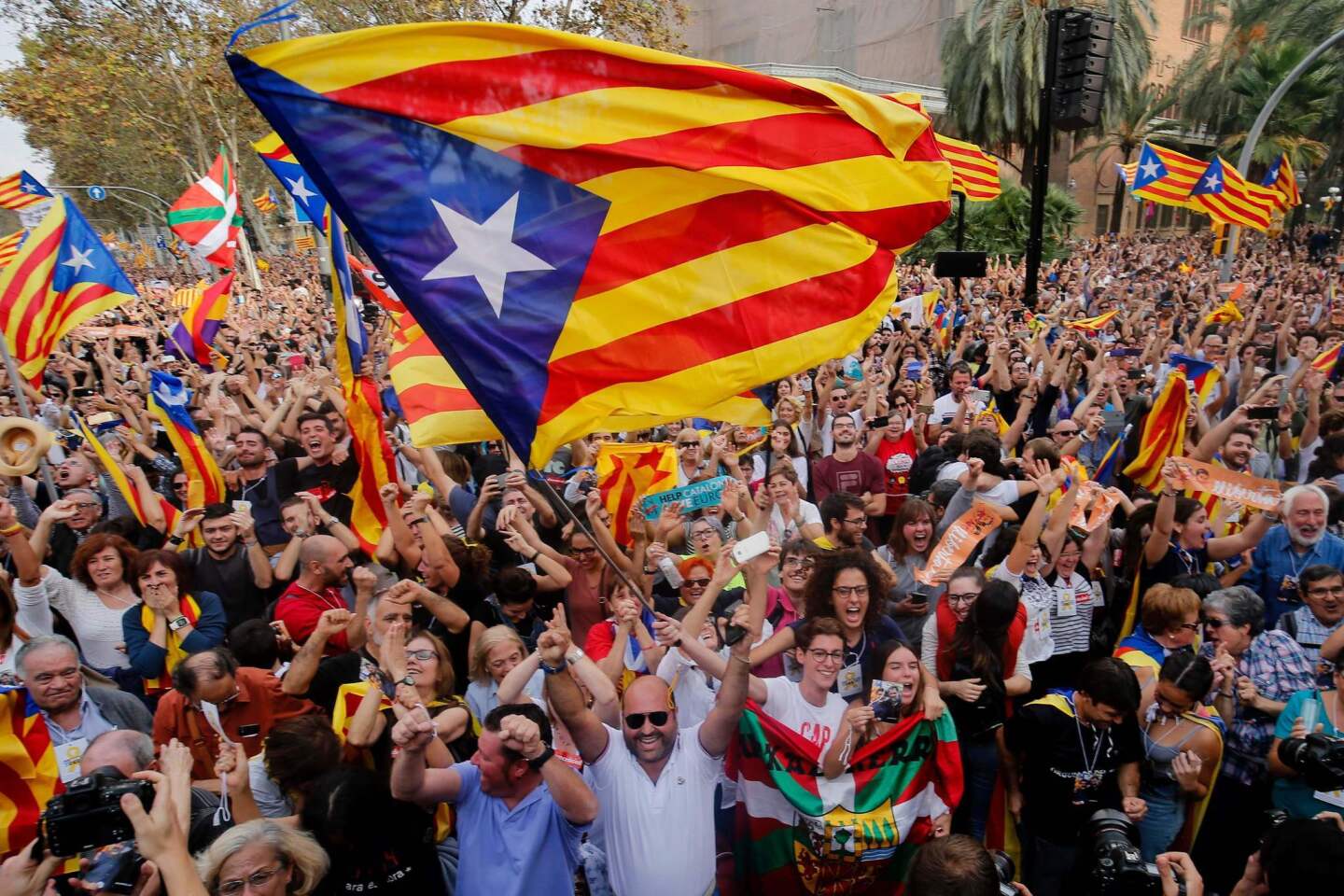 People celebrate in Barcelona after Catalonia's parliament voted to declare independence from Spain.