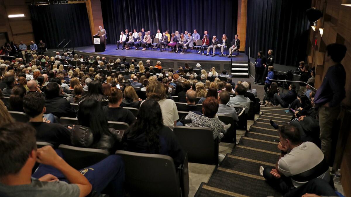 Community members fill the Corona del Mar High School theater Thursday night for an open forum in response to photos of area high school students at a party flashing Nazi salutes around a swastika made of red plastic cups.