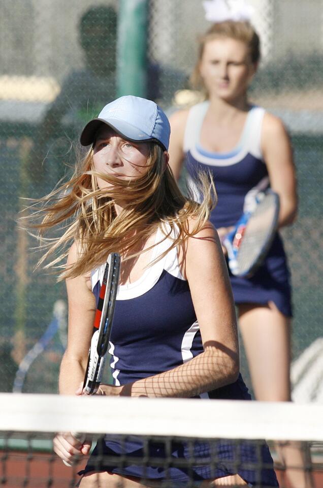 Crescenta Valley's Viktoriya Shumakova looks to return a Burbank shot with teammate Jacqueline Dilanchyan in a Pacific League girls tennis match at Burbank High School on Tuesday, October 16, 1012.