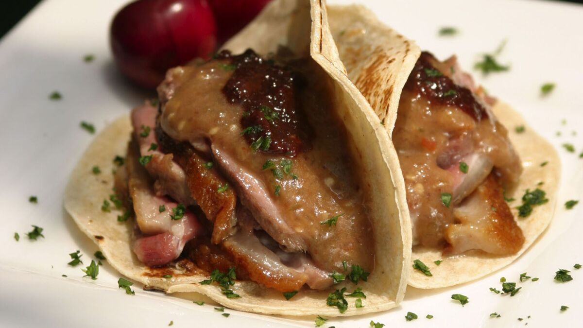 Duck tacos with chile-cherry compote.