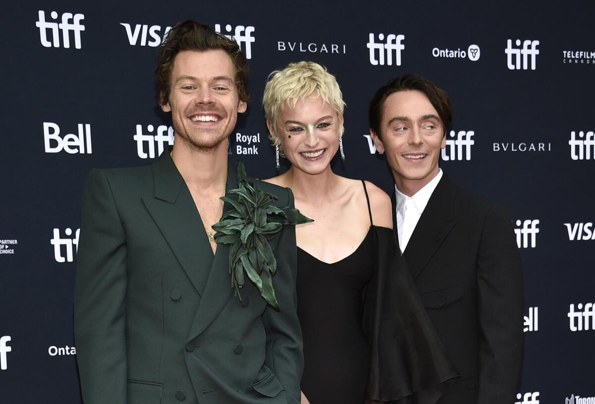 Harry Styles, from left, Emma Corrin, and David Dawson attend the premiere of "My Policeman" at the Princess of Wales Theatre during the Toronto International Film Festival, Sunday, Sept. 11, 2022, in Toronto. (Photo by Evan Agostini/Invision/AP)