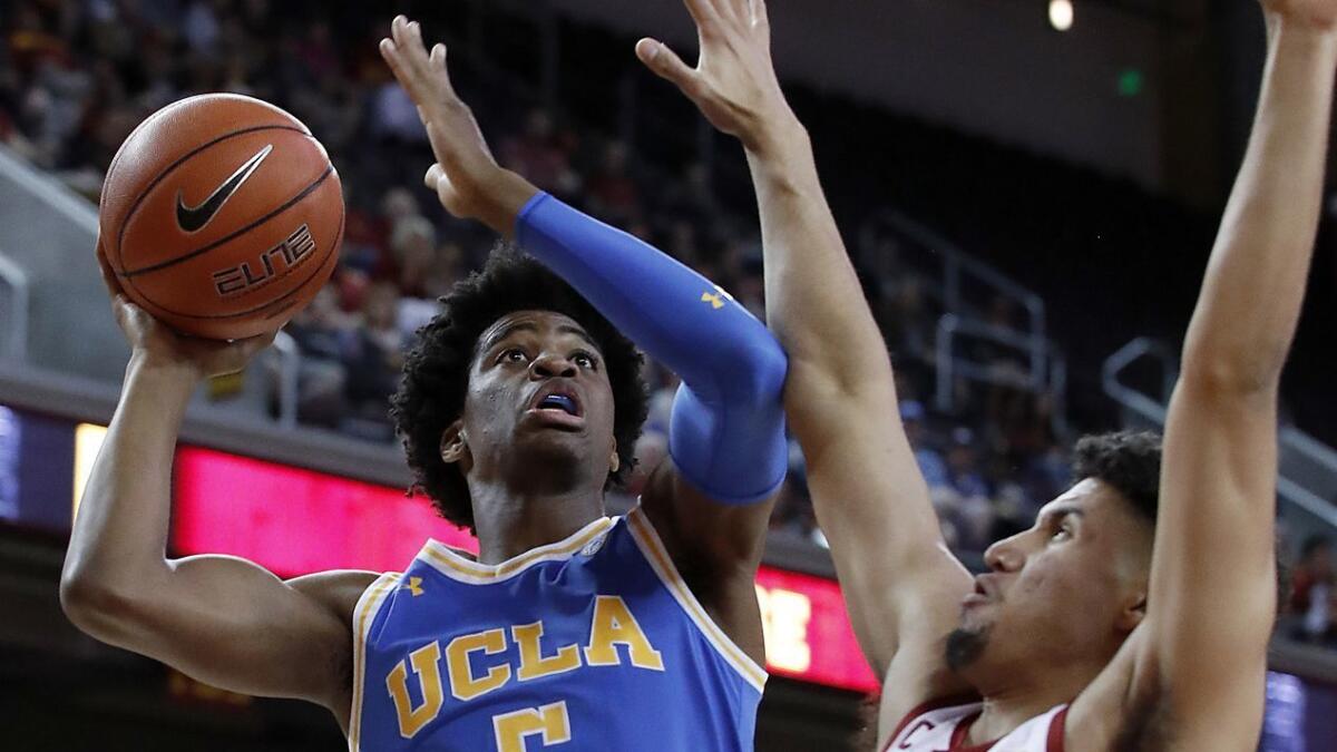 UCLA guard Chris Smith goes to the basket against USC forward Bernie Boatwright in the first half on Jan. 19, 2019, at the Galen Center.