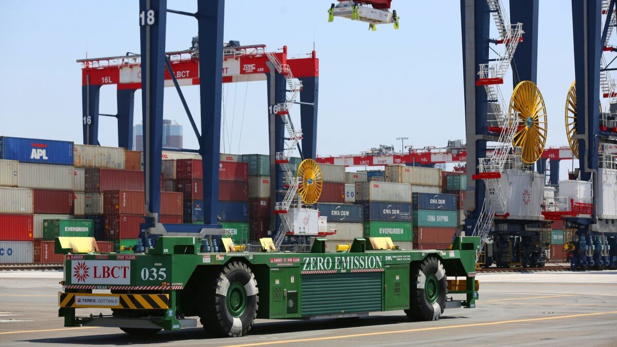 A driverless, electric-powered vehicle at the Long Beach Container Terminal. Similar automation has been proposed for the Port of Los Angeles, sparking a bitter protest from union workers.