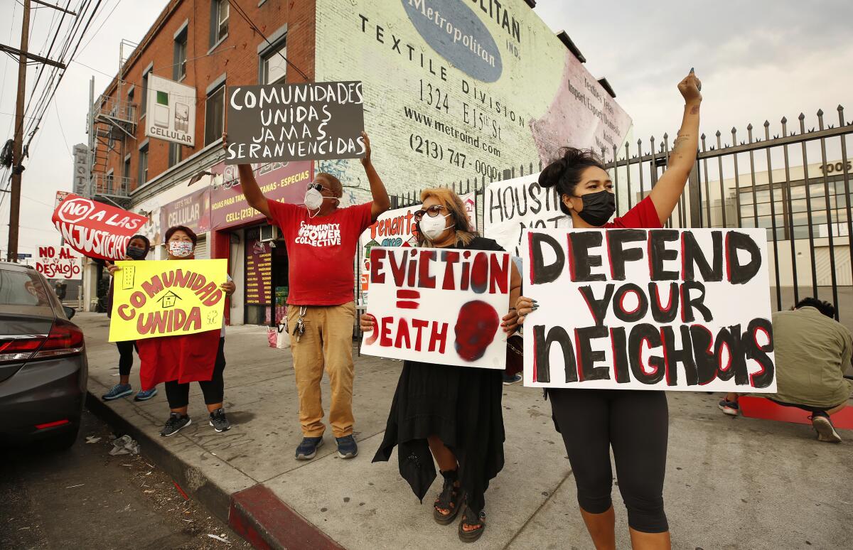 People protest evictions at a downtown Los Angeles apartment building in October 2021.