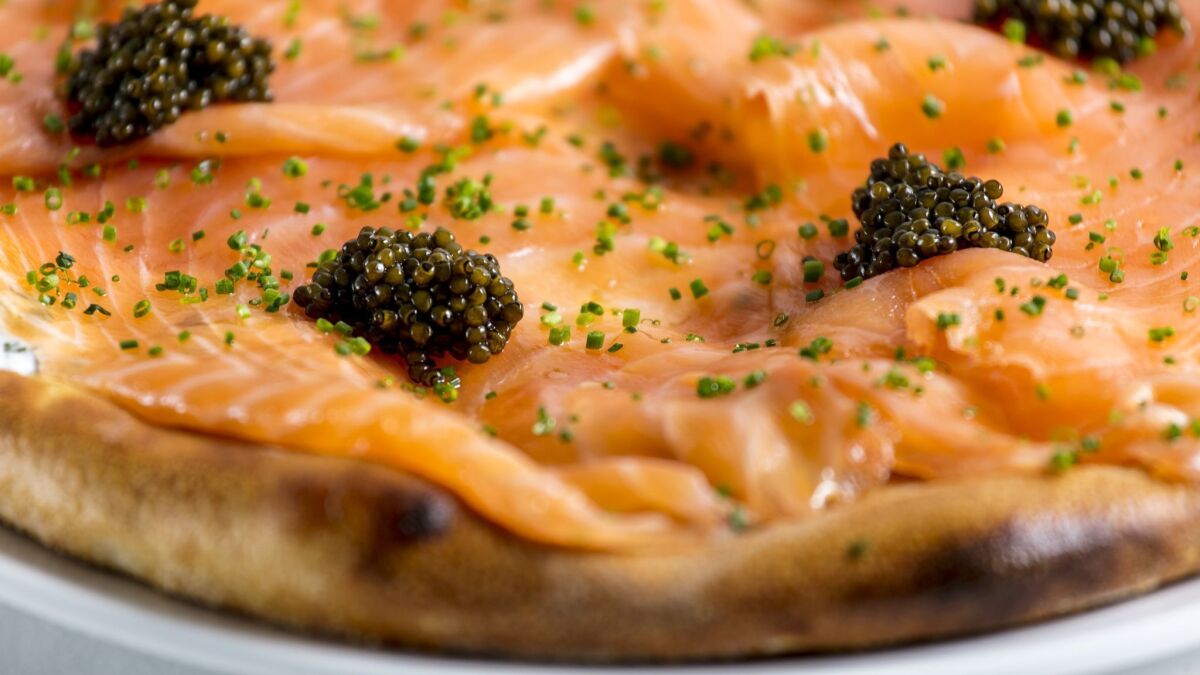 Spago's classic pizza with house-cured smoked salmon, red onion, dill crème fraiche and fish roe isn't on the menu anymore but is available by request.
