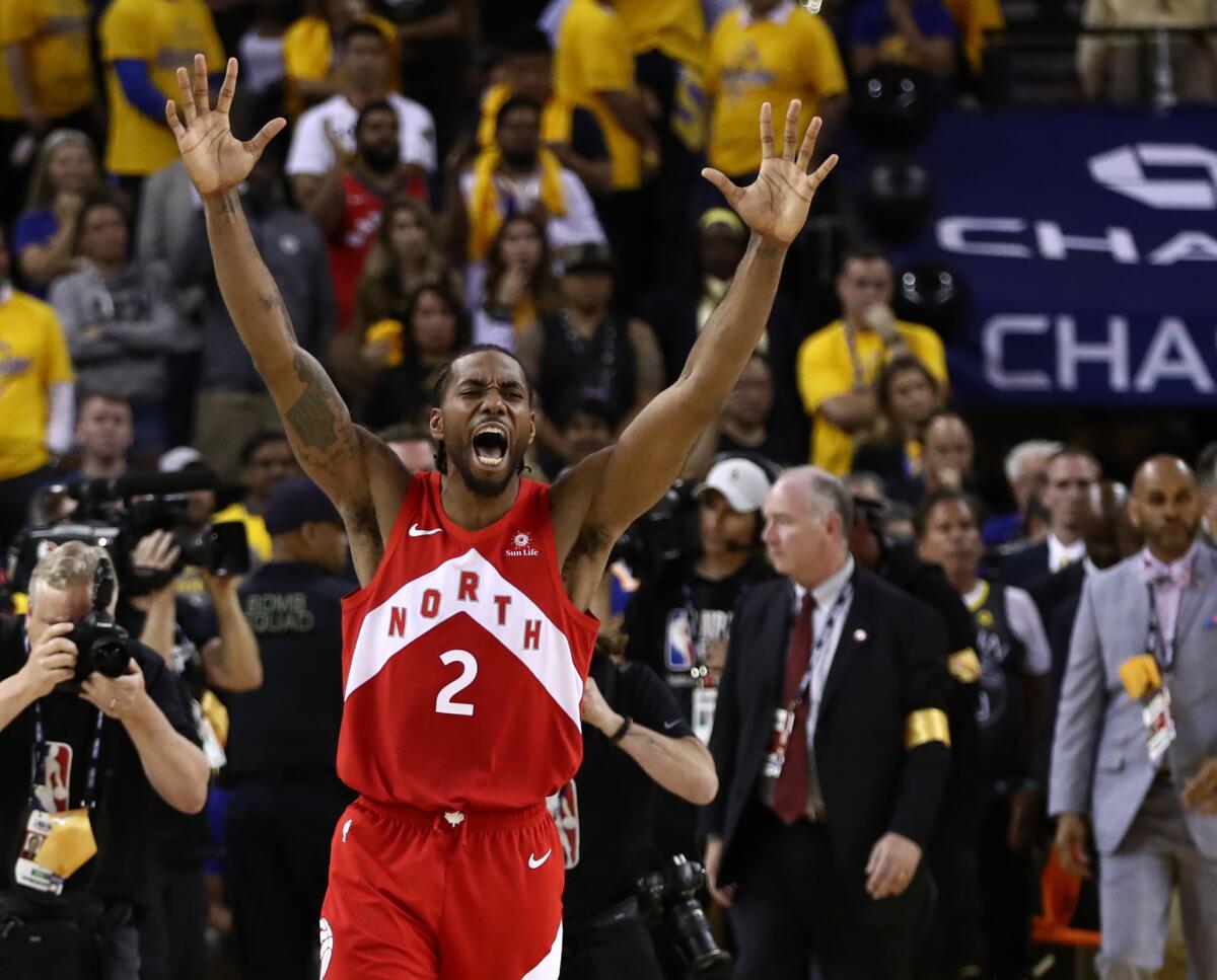 Toronto's Kawhi Leonard celebrates after the Raptors defeated the Golden State Warriors to win the 2019 NBA championship at Oracle Arena in Oakland on June 13, 2019.