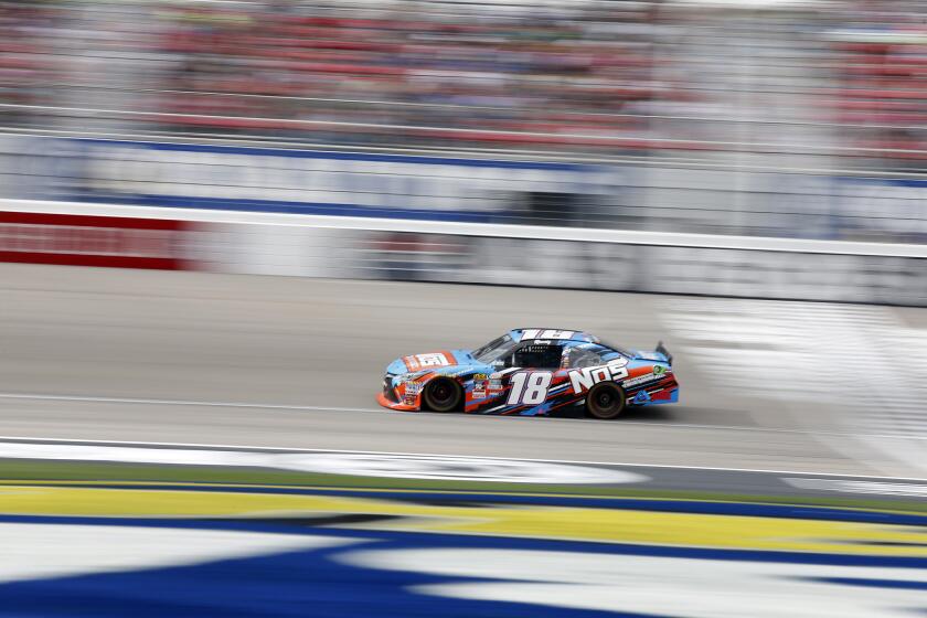 Kyle Busch leads the NASCAR Xfinity Series race on Saturday in Las Vegas.