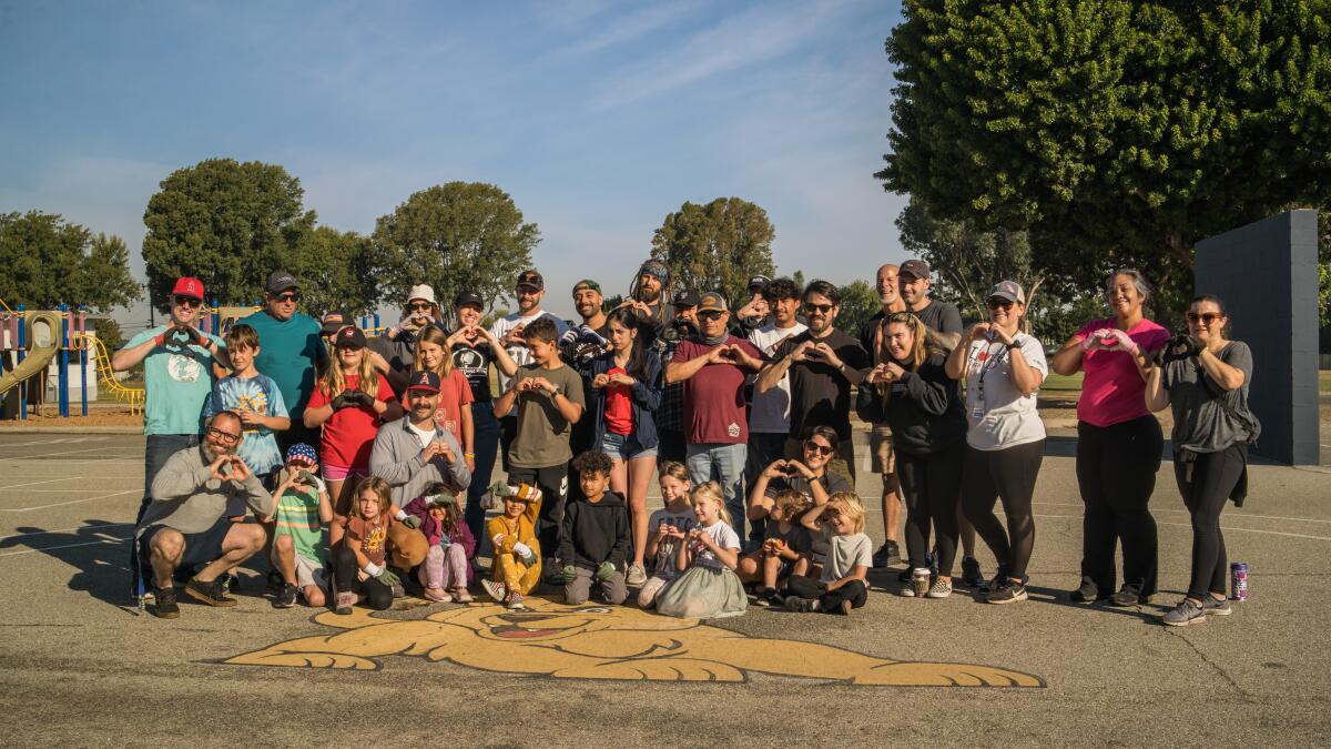 Families, students and volunteers at California Elementary School pose for a photo.