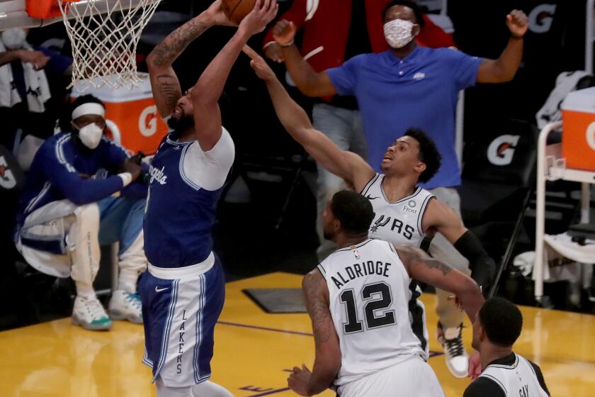 LOS ANGELES, CA. - JAN. 7, 2021. Lakers center Anthony Davis goes up for a dunk against the Spurs in the third quarter on Thursday night, Jan. 7, 2021, at Staples Center in Los Angeles. (Luis Sinco/Los Angeles Times)